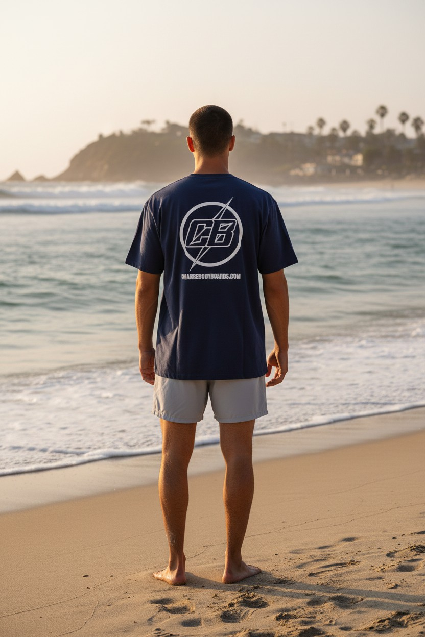Man in navy shirt standing on beach