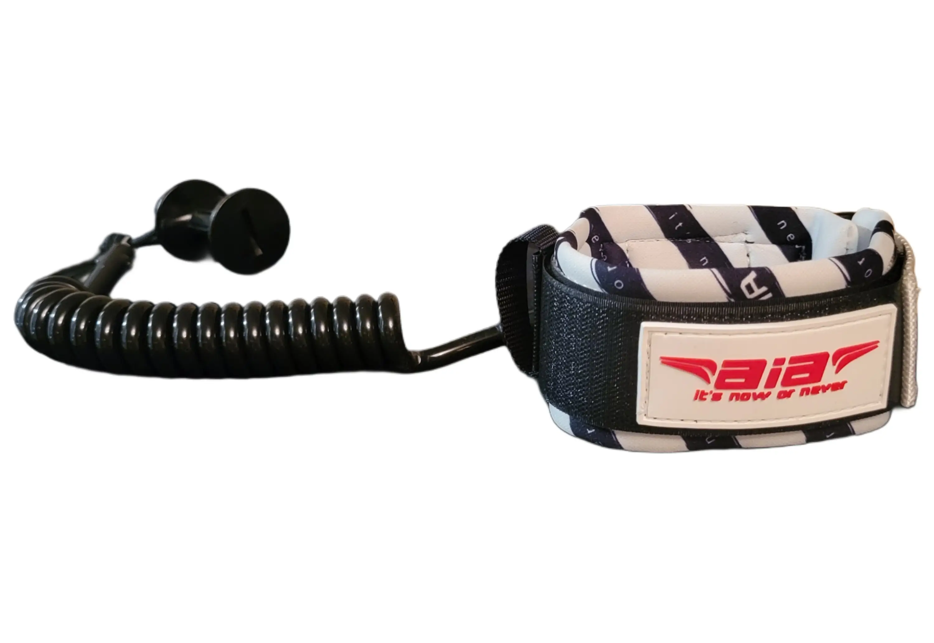 A vintage police radio microphone with a coiled cord.