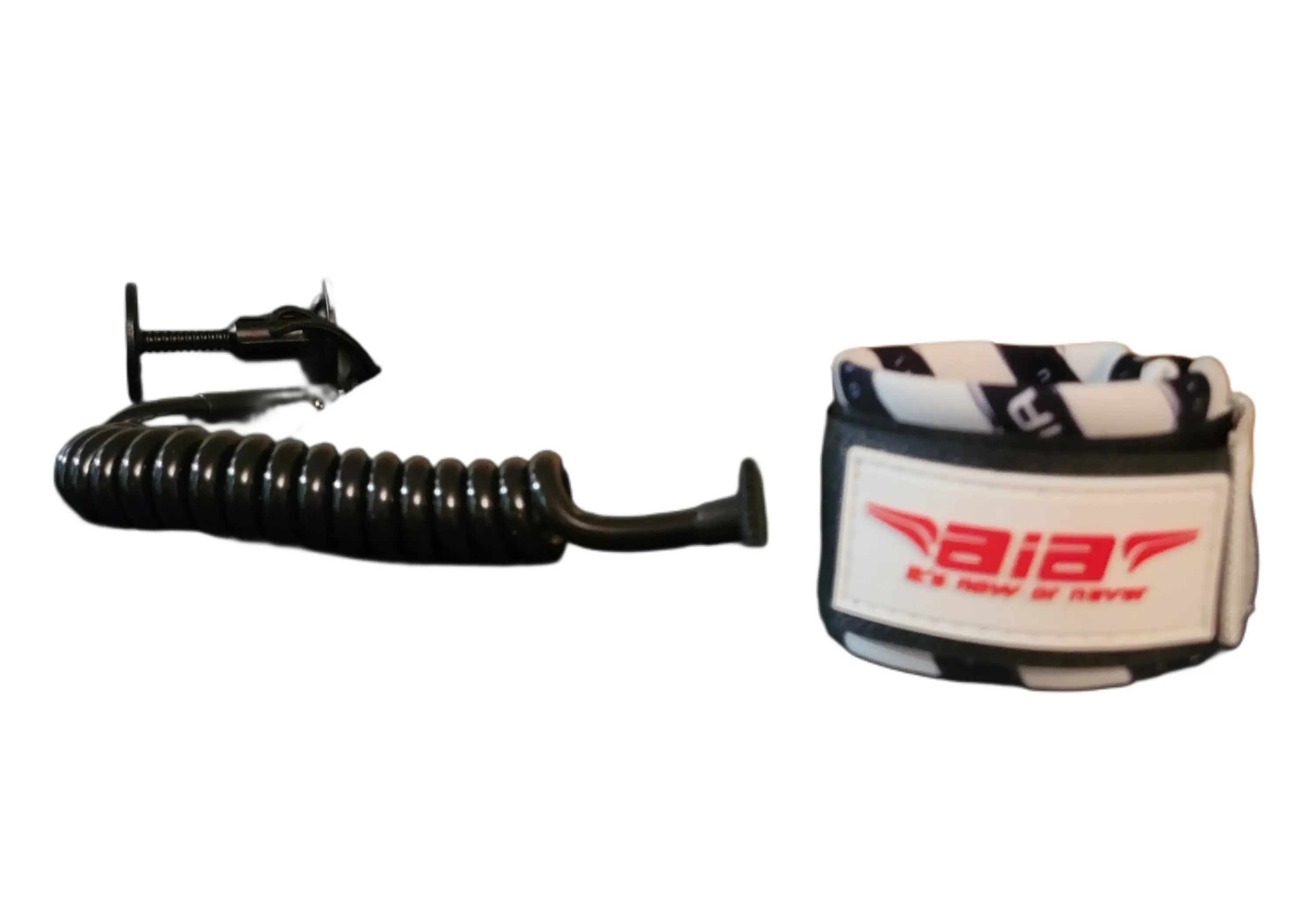 A black coiled cable and a small white device with a red logo.